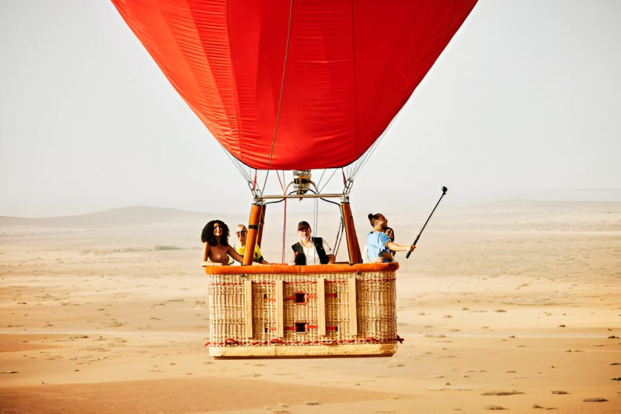 Family and friends on early morning hot air balloon ride with Emoji Traveling