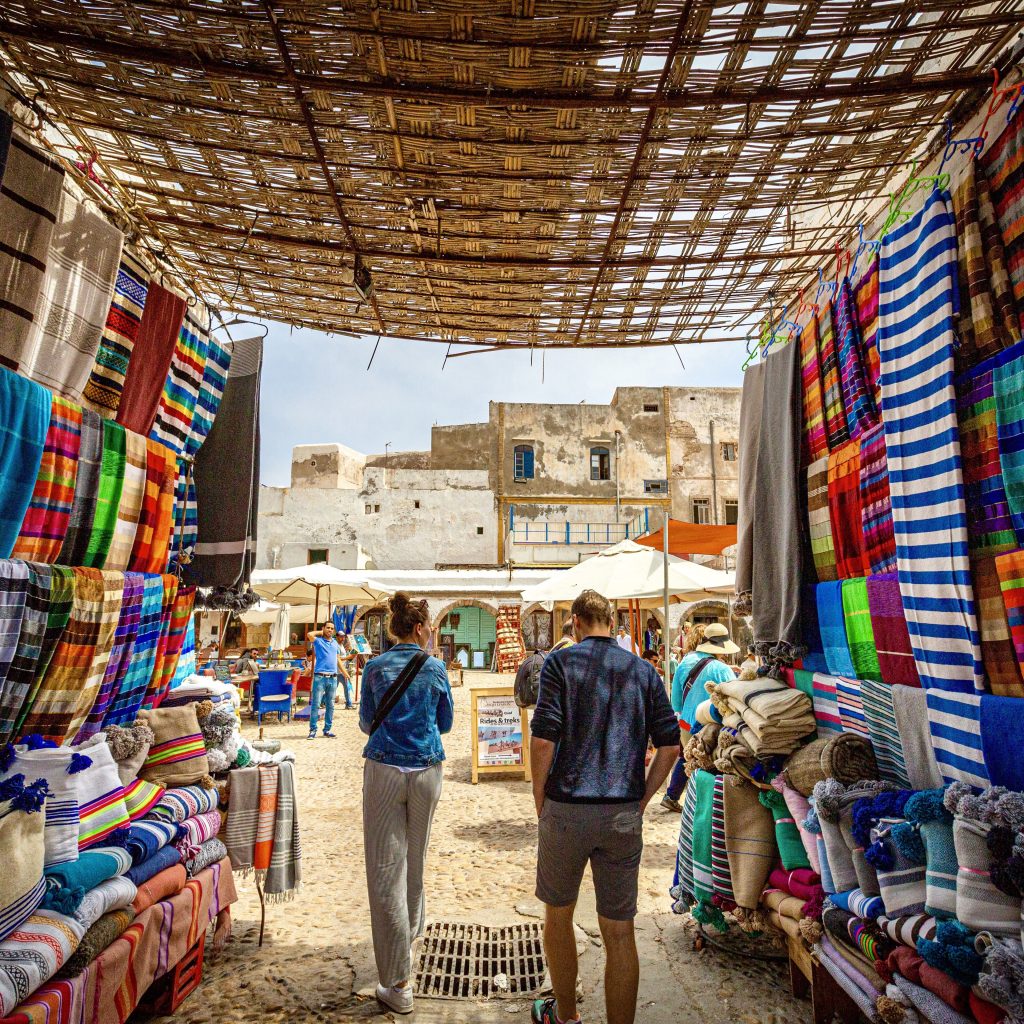 tourists-walking-through-moroccan-market-of-colour-2022-11-16-17-07-52-utc(1)